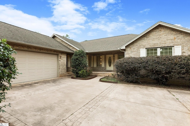 ranch-style home featuring a garage