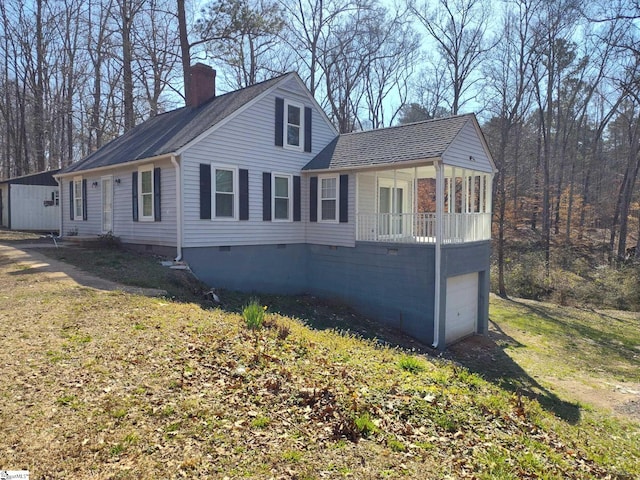 view of property exterior with a garage