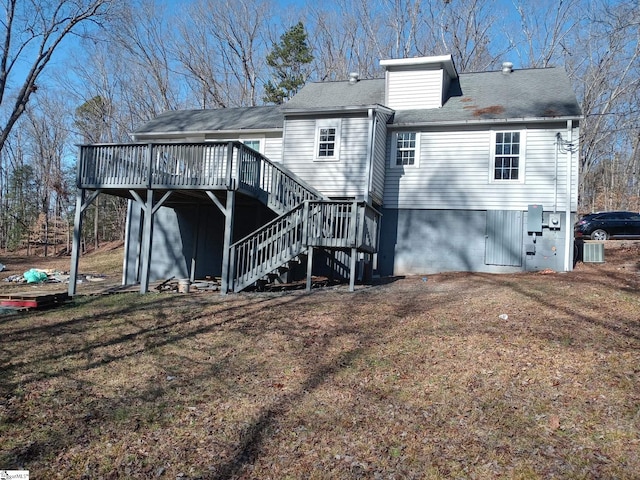 rear view of property featuring a deck