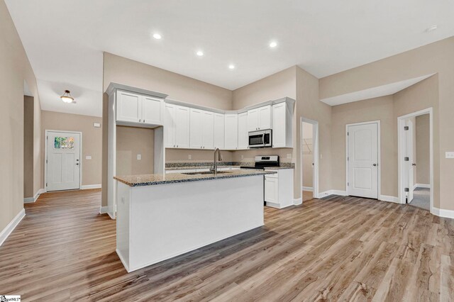 unfurnished room featuring a raised ceiling