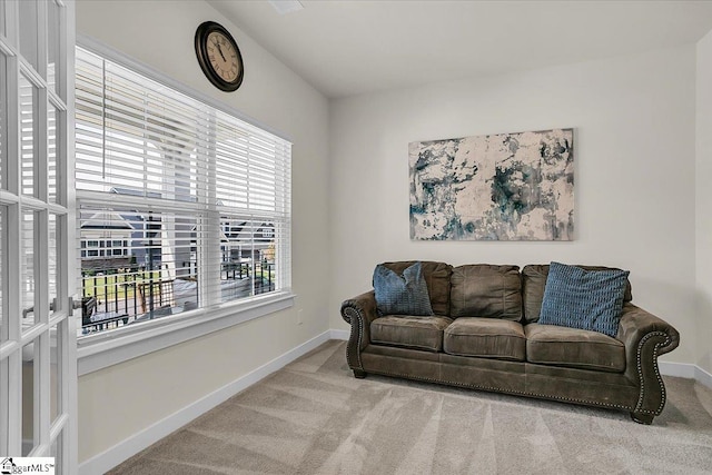 carpeted living room featuring a healthy amount of sunlight