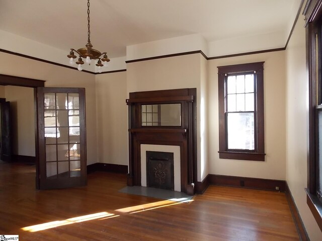 living room with hardwood / wood-style floors and an inviting chandelier