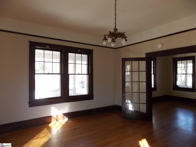 living room featuring wood-type flooring and a notable chandelier