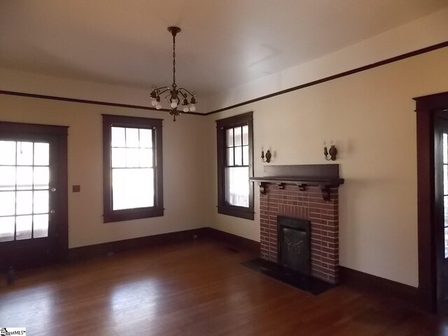 kitchen featuring dark hardwood / wood-style flooring, crown molding, and black appliances