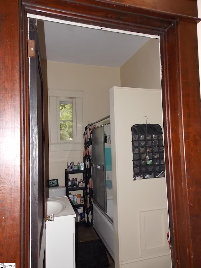 bathroom featuring vanity and shower / bath combo