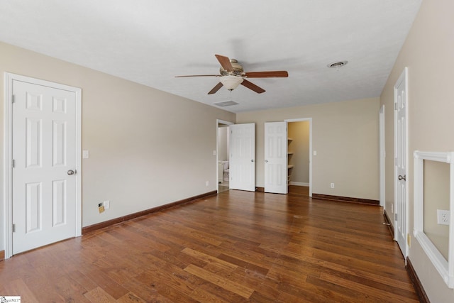 unfurnished bedroom with ceiling fan and wood-type flooring