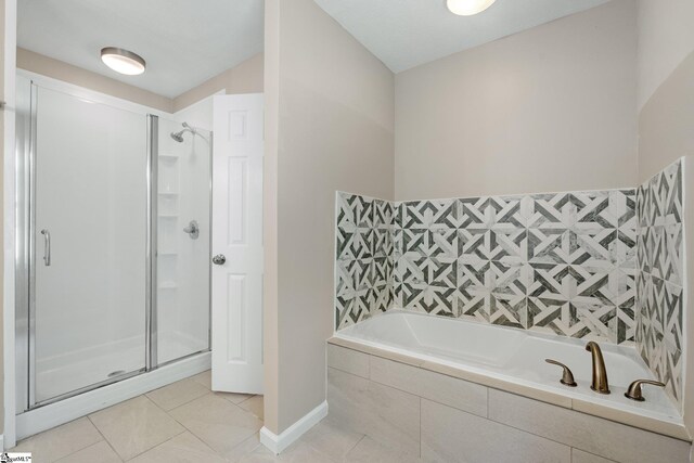 bathroom with plus walk in shower and tile patterned flooring