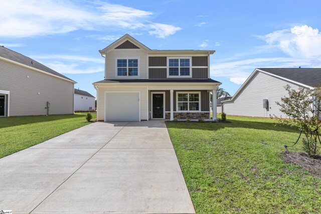 view of front of house with a garage, a porch, and a front lawn