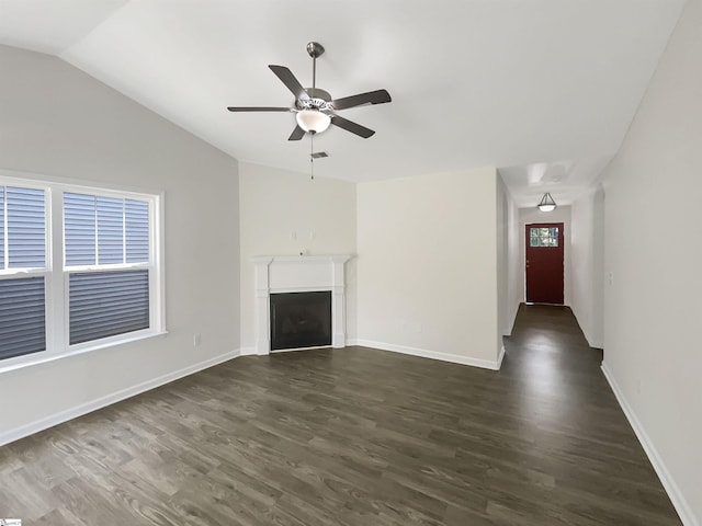 unfurnished living room featuring dark wood-style floors, a fireplace, lofted ceiling, ceiling fan, and baseboards