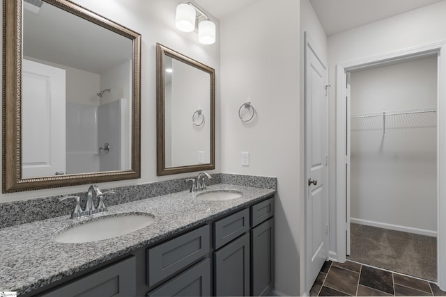 bathroom with vanity and walk in shower