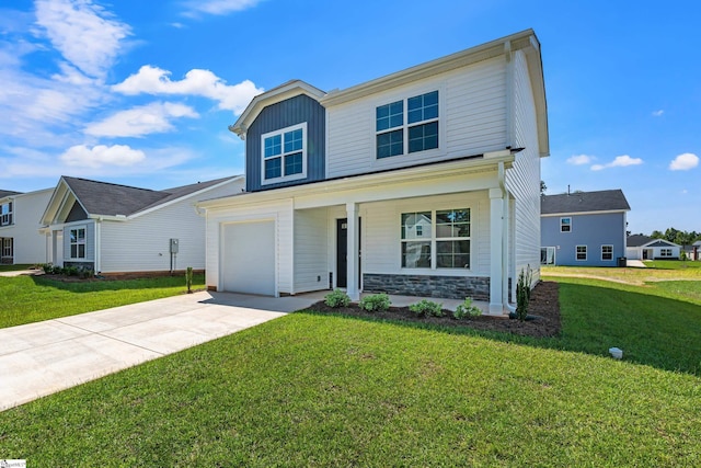 view of front of property with a front yard, a garage, and a porch