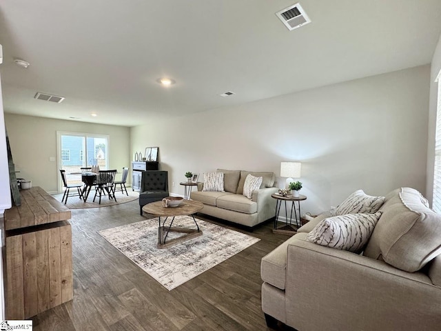 living room with dark wood-type flooring