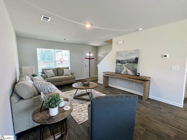 living room with dark hardwood / wood-style floors