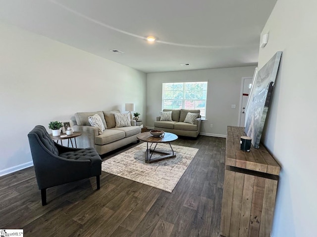 living room featuring dark hardwood / wood-style floors