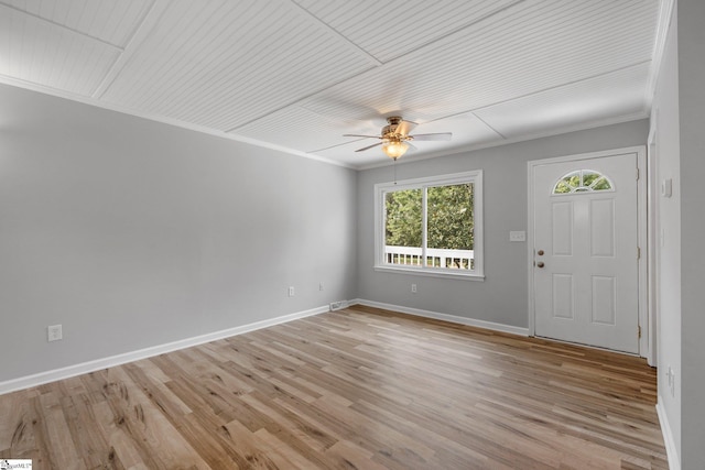 interior space featuring ceiling fan, light hardwood / wood-style flooring, and crown molding