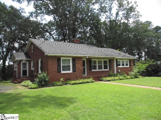 ranch-style house with a front lawn