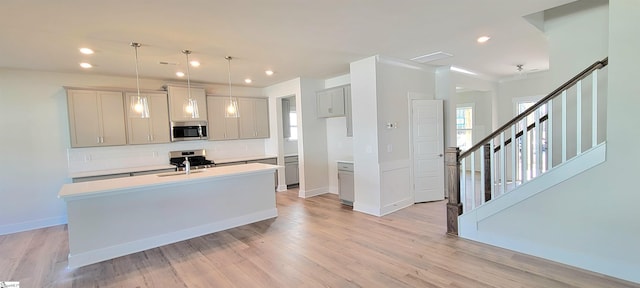 333 Alyssa Landing Dr Unit 72, Fountain Inn, SC 29644 - kitchen featuring stainless steel appliances, backsplash, light countertops, an island with sink, and recessed lighting