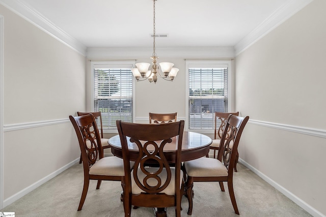 carpeted dining area with a wealth of natural light, ornamental molding, and an inviting chandelier