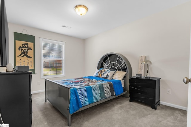 bedroom featuring light carpet