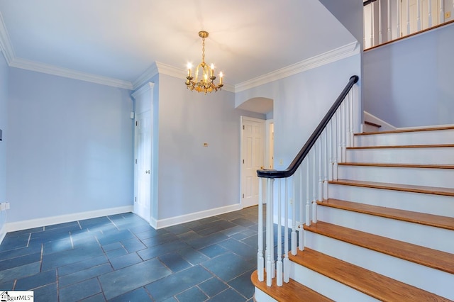 foyer with stone tile flooring, crown molding, stairway, and baseboards