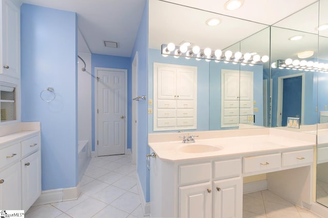 full bath featuring bathtub / shower combination, tile patterned flooring, visible vents, vanity, and baseboards