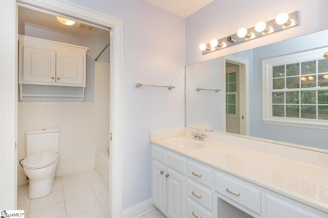 full bath featuring shower / washtub combination, tile patterned flooring, vanity, and toilet