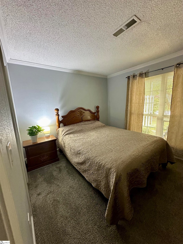 bedroom featuring crown molding, a textured ceiling, and carpet floors