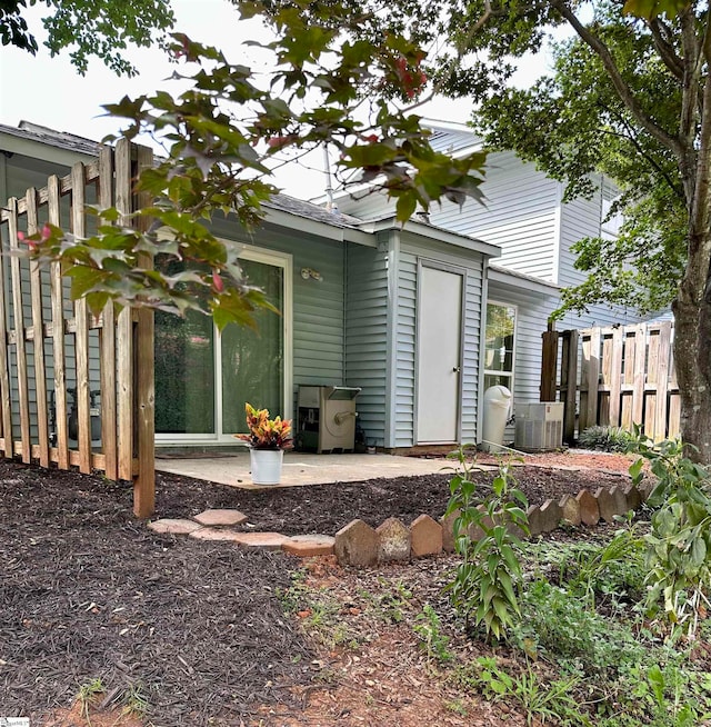 back of house with a patio