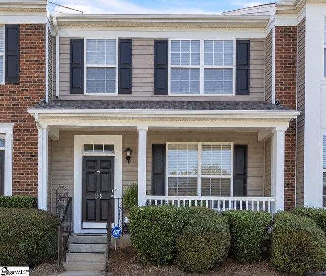 view of front of property featuring covered porch