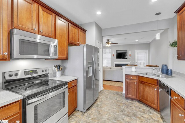 kitchen featuring stainless steel appliances, sink, ceiling fan, light tile patterned flooring, and hanging light fixtures