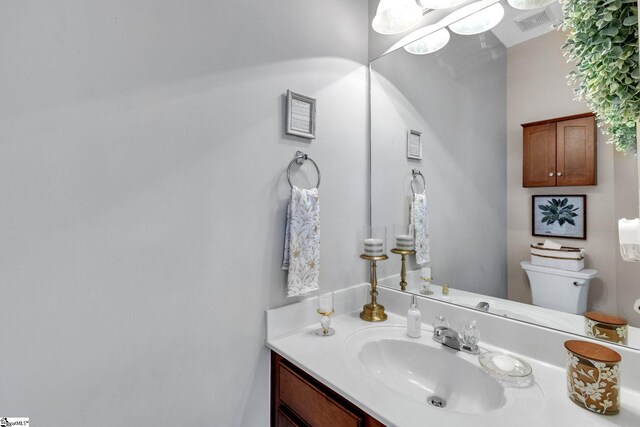 bathroom with vanity and toilet