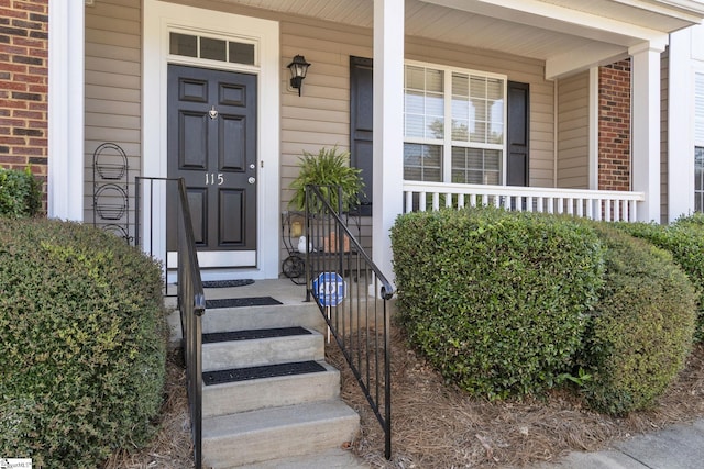 property entrance featuring covered porch