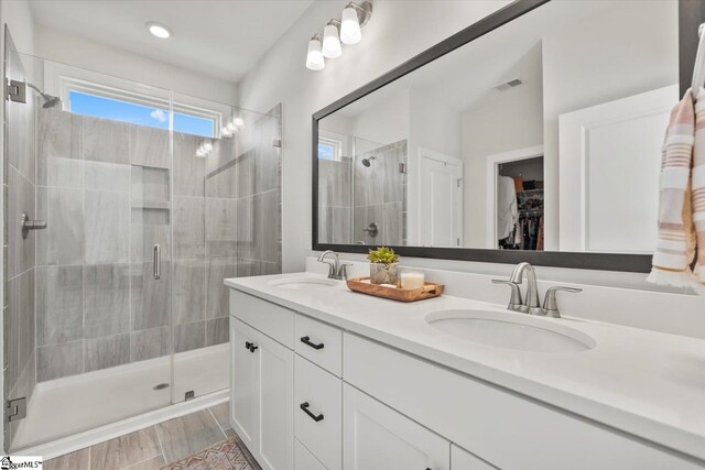 bathroom with hardwood / wood-style flooring and vanity