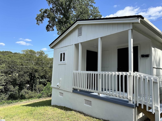 view of home's exterior featuring a yard and crawl space