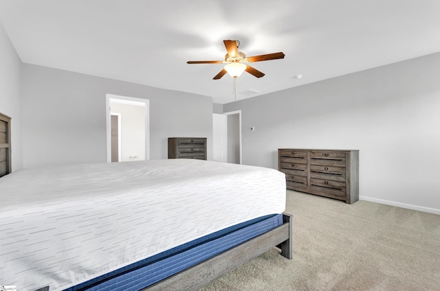 bedroom with baseboards, a ceiling fan, and carpet
