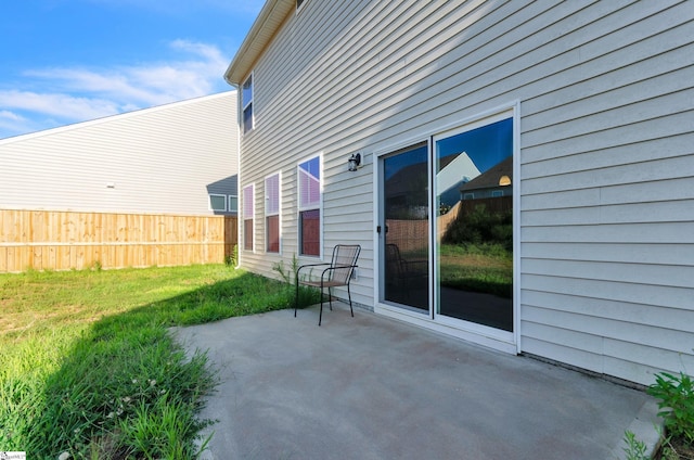 view of patio / terrace featuring fence