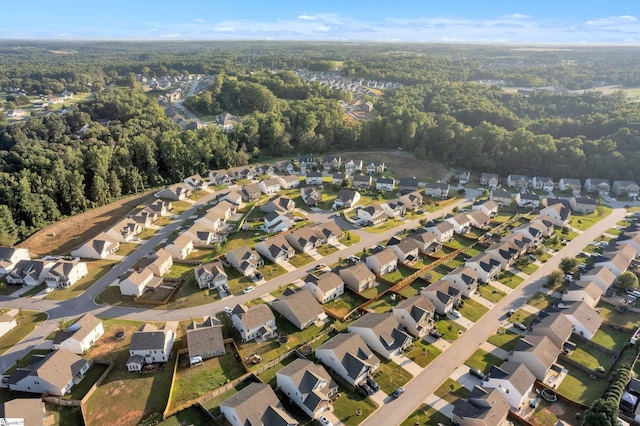 aerial view with a forest view and a residential view