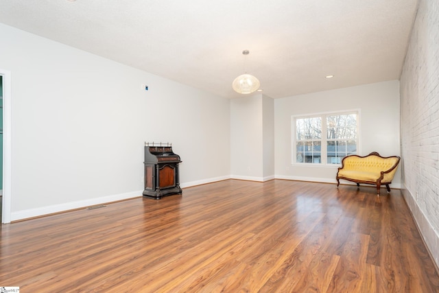 unfurnished room featuring hardwood / wood-style floors