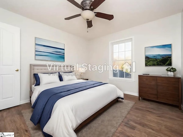 bedroom featuring ceiling fan and dark hardwood / wood-style floors