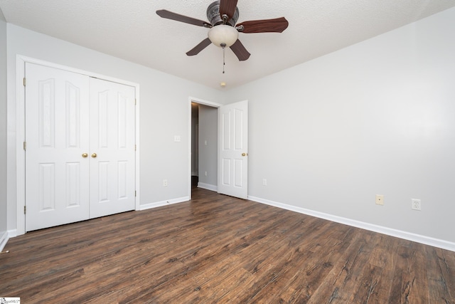 unfurnished bedroom with ceiling fan, a closet, a textured ceiling, and wood-type flooring