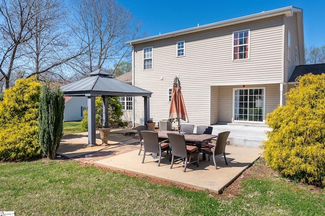 back of house featuring a patio and a gazebo