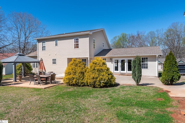 exterior space featuring a patio, french doors, a gazebo, and a lawn