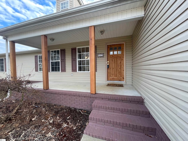 entrance to property with covered porch