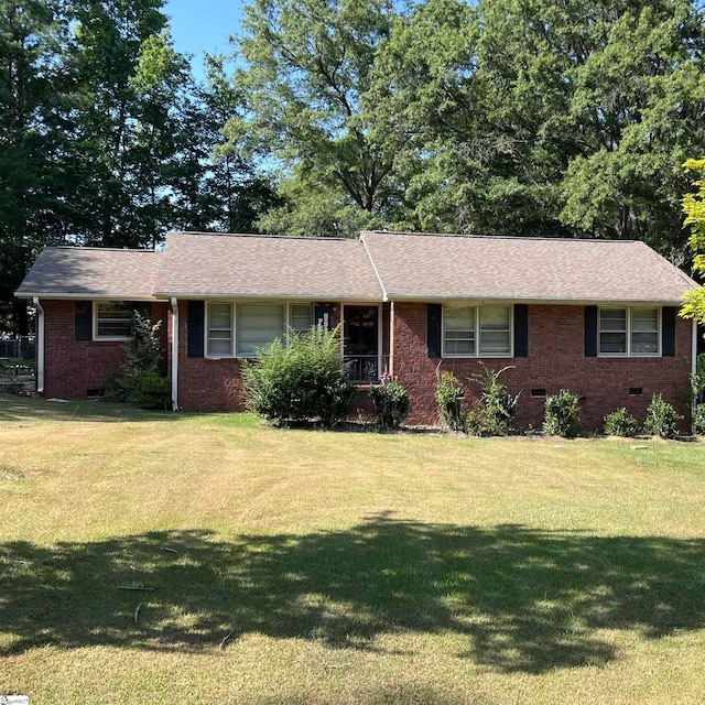 ranch-style house with a front lawn