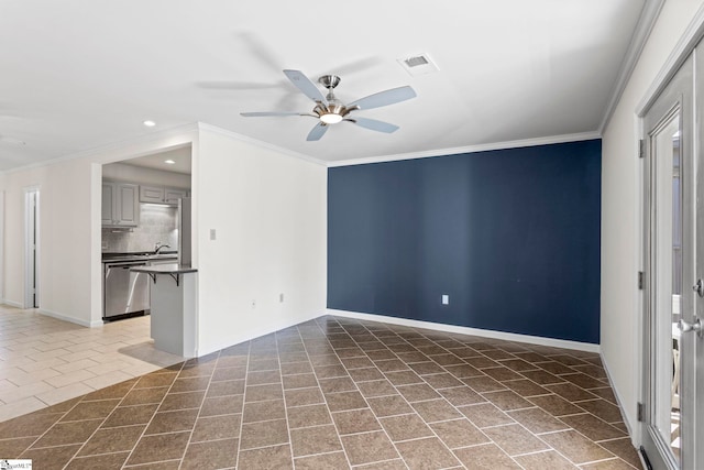 tiled spare room with ceiling fan and crown molding