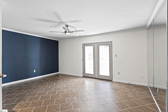 tiled empty room with ceiling fan, crown molding, and french doors