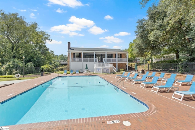 view of swimming pool featuring a patio area