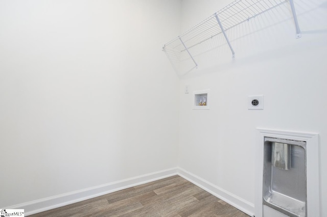 laundry room with hardwood / wood-style floors, electric dryer hookup, and hookup for a washing machine