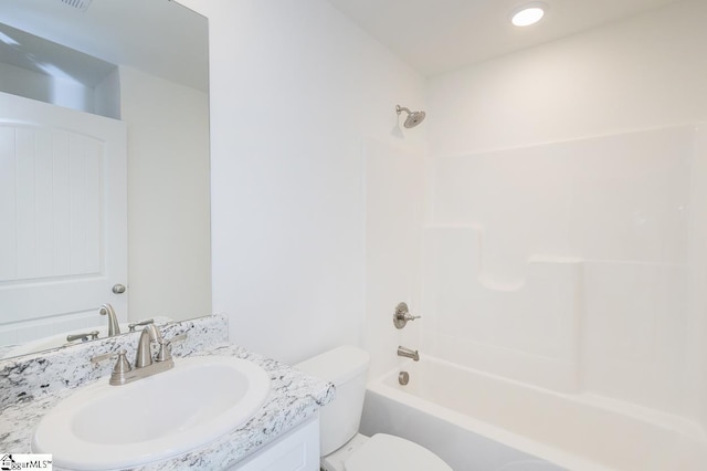 full bathroom featuring shower / bathing tub combination, vanity, and toilet