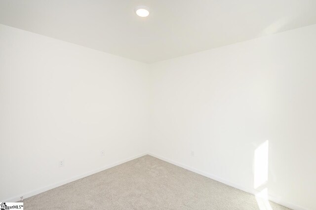 spare room with carpet floors